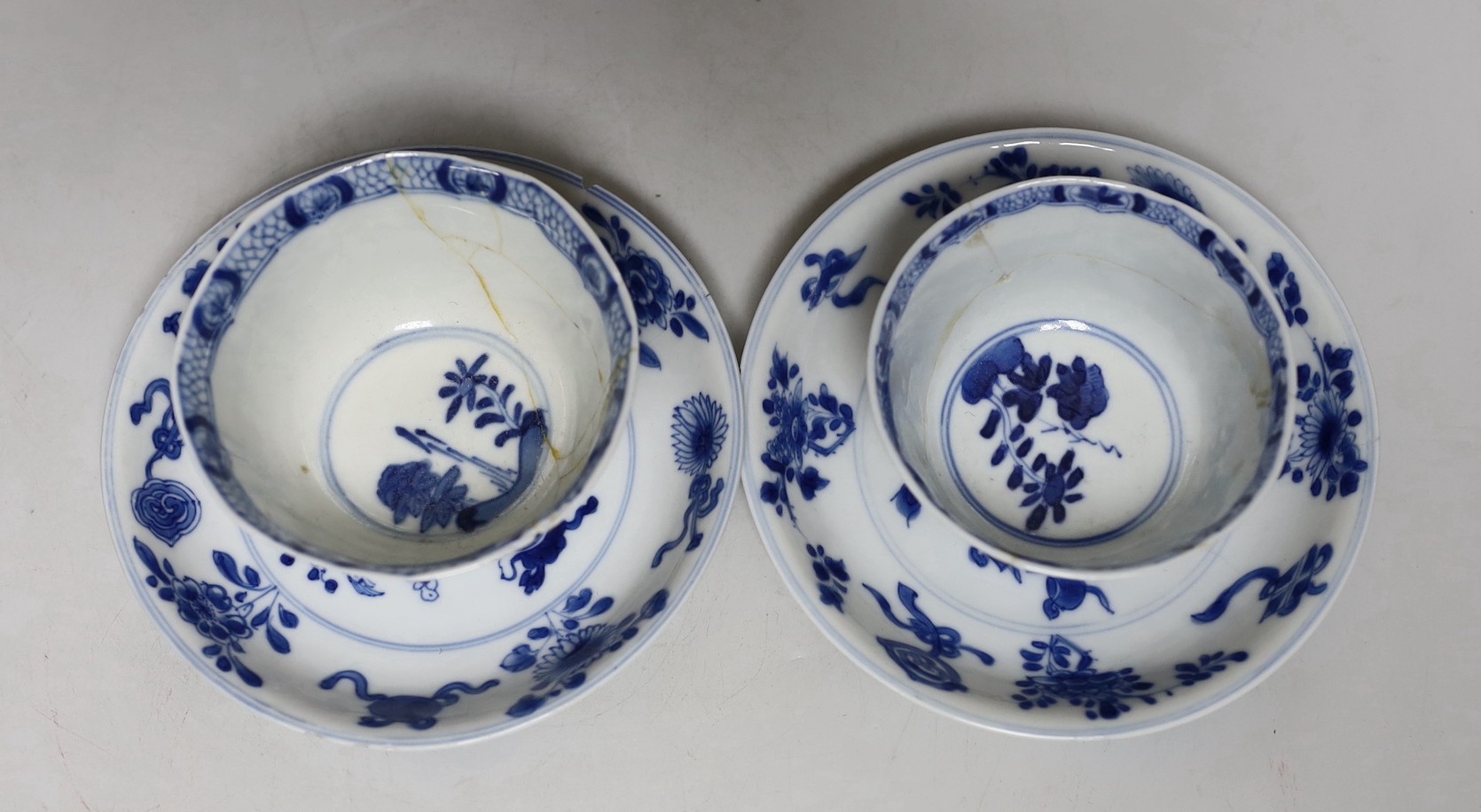 A Chinese blue and white landscape dish, Qianlong period 31cm diameter, together with a similar pair of tea bowls and saucers